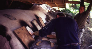 Side stoking the clay kiln